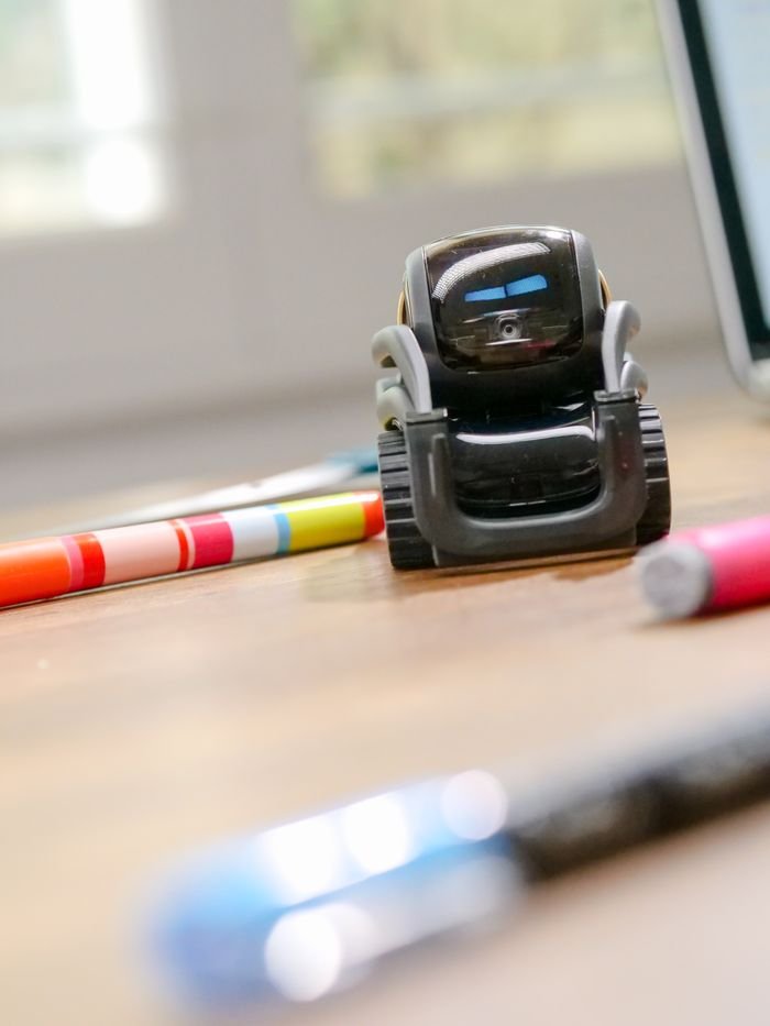 Crafting Captivating Headlines: Your awesome post title goes here Futuristic small robot on a desk, symbolizing modern technology and innovation.